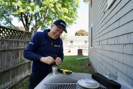 tech working on an AC unit