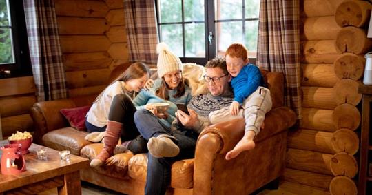 Small family relaxing on the sofa