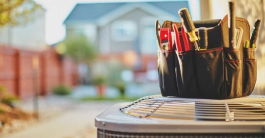 tool box placed on top of an HVAC outdoor unit