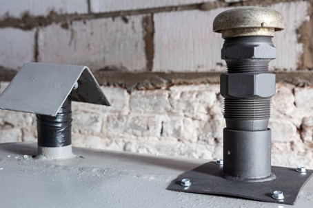 two vents on a gray surface