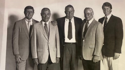 Jim Townsend, (far left), Warren Townsend (middle), Mark Townsend (far right) with business associates Photo