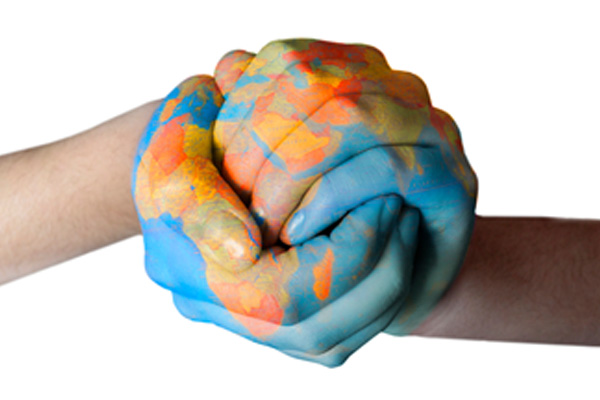 image of hands holding planet depicting carbon emissions