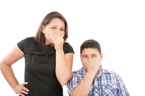 image of mother and son plugging nose due to bad air conditioner odor