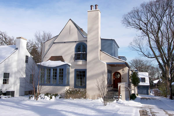 house in snow depicting home heating in winter