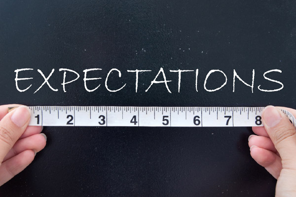 the word expectations and ruler depicting measuring expectations of a new oil boiler upgrade