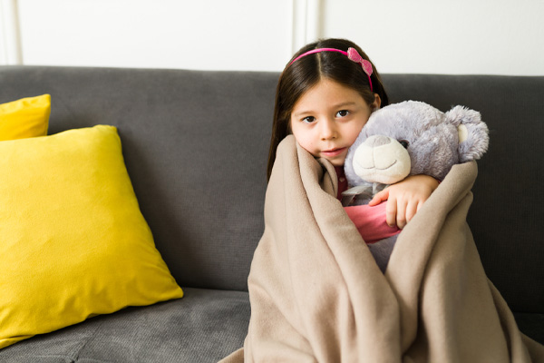 image of a child feeling chilly due to old hvac ductwork