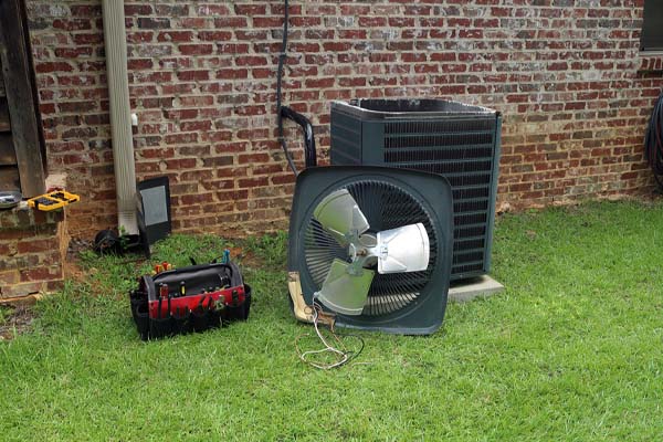 image of air conditioner compressor that requires hvac repair