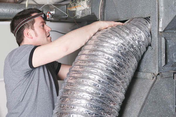 hvac contractor servicing or repairing a home ventilation system