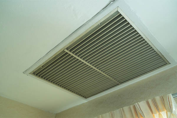 large square return hvac air vent located in the ceiling of a home