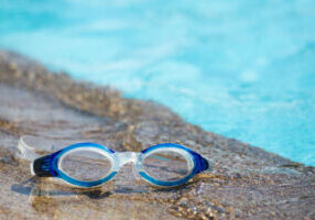 goggles by pool depicting propane pool heater